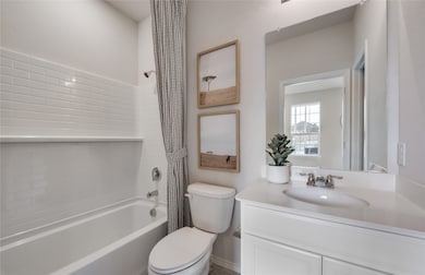 Secondary bathroom featuring premium fixtures and finishes *Model representation
