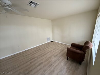 Sitting room featuring ceiling fan and light hardwood / wood-style flooring
