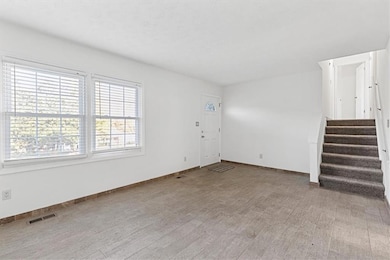 Unfurnished living room with light hardwood / wood