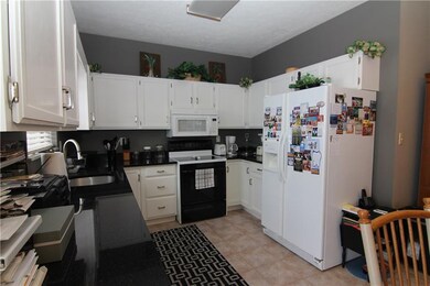 Kitchen with nice granite counter space.