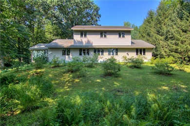 Rear exterior view! Home has a steel roof that was installed in the 2010 +/- timeframe.