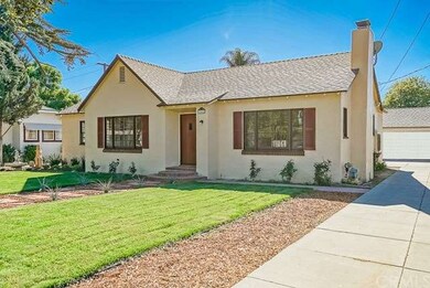 View of long driveway with 2-car detached garage, 