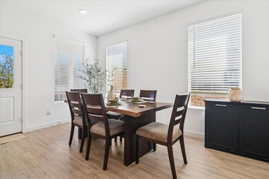 Dining space featuring light wood finished floors and baseboards