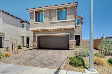 View of front of home featuring stucco siding, an