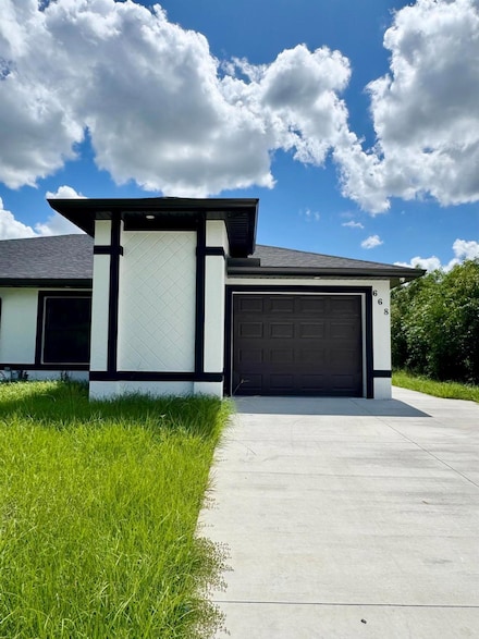 668 Chemstrand St E, Lehigh Acres, FL 33974