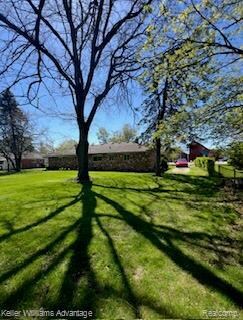 206 N John St, Highland, MI 48357