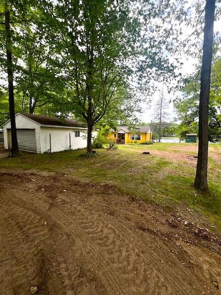 7777 N Manitonka Dr, Weidman, MI 48893