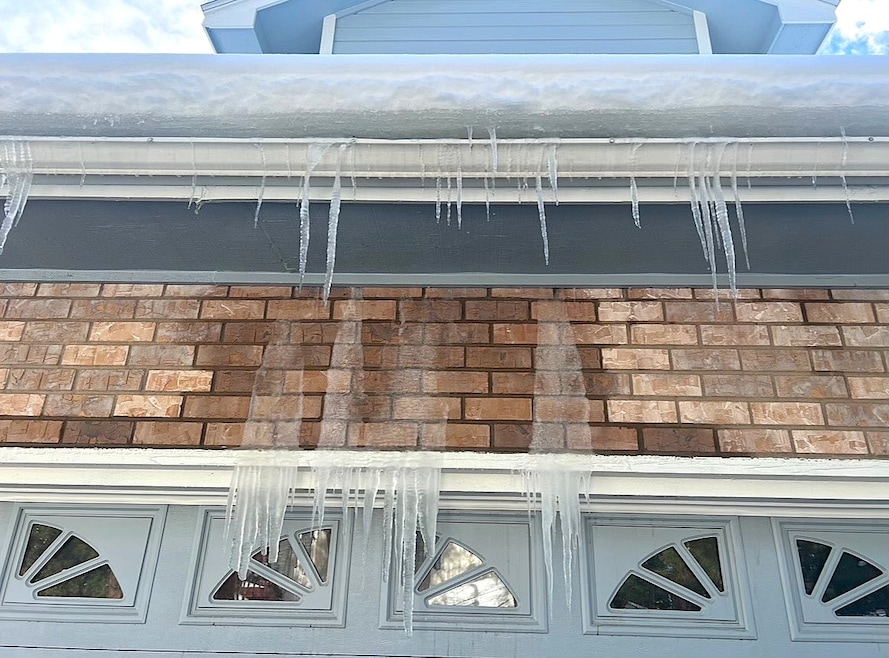 Ice damming found on the northern facing slope of a roof in Colorado.  To combat the issue, Triton Roofing &amp; Solar in Colorado Springs, Colorado, ran a heat wire in the gutter. (Curt Borst/ Triton Roofing &amp; Solar) 
