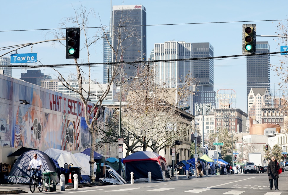 Gov. Gavin Newsom wants California's cities to ban homeless encampments. Above: Homeless encampments line Skid Row in Los Angeles in 2022. (Mario Tama/Getty Images)