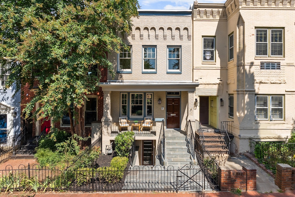 The house's front porch is unusual for Capitol Hill, as is some of the distinctive brick detailing on the front facade. (Townsend Visuals)