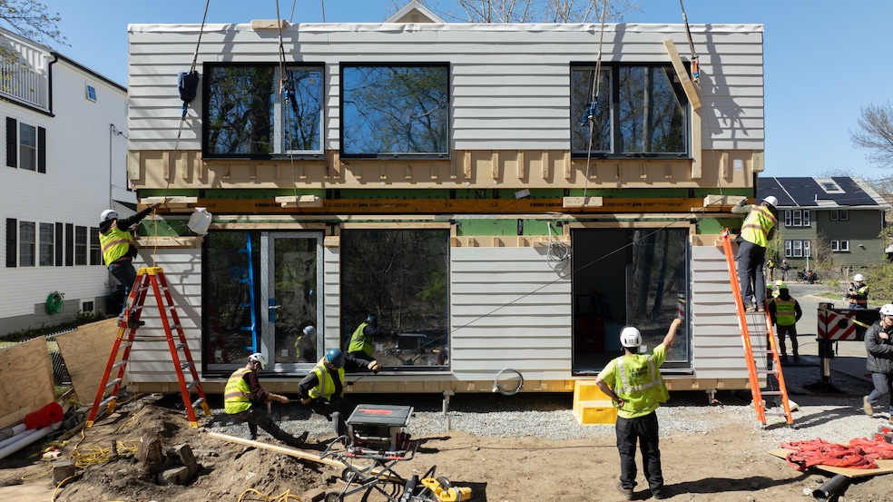 A Reframe team assembles a house in Massachusetts that was built in a factory. (Reframe Systems)