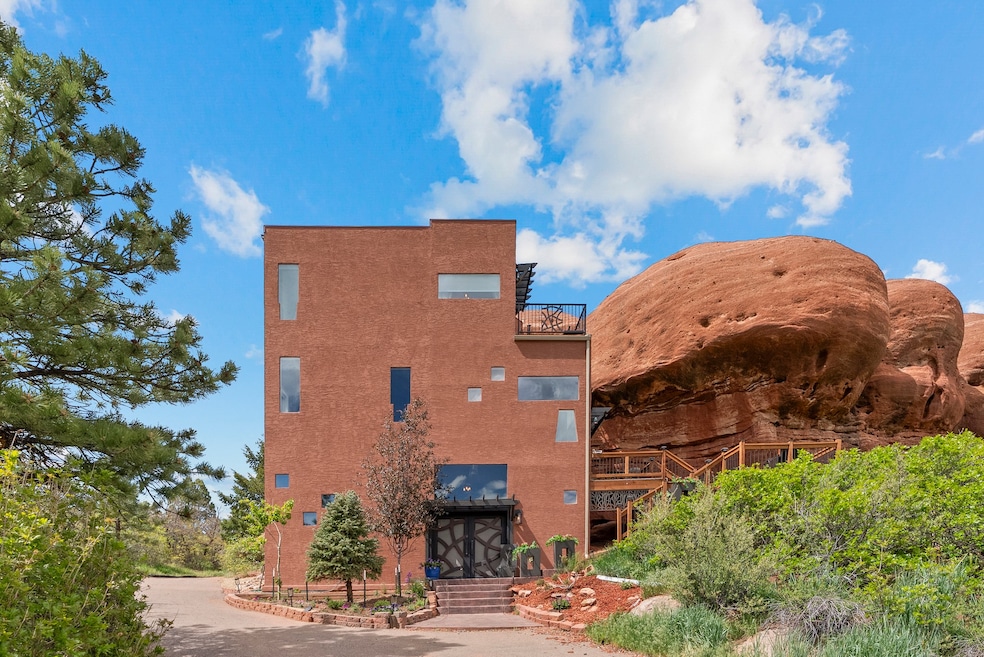 The two-bedroom, two-bathroom home was constructed around the red rock. (Creative Edge Media)