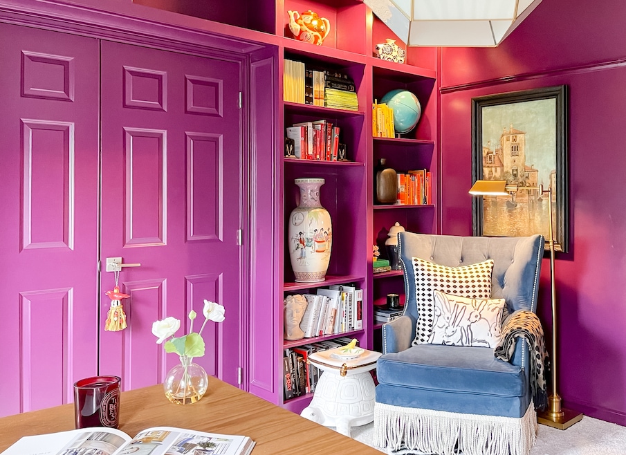 Once a formal living room, this color-drenched space now hosts a library. (Your Colorful Home Interiors)