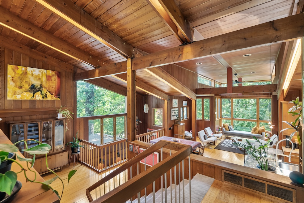 The home's fourth level includes a living room, dining area, kitchen, and two balconies. (Keller Williams Realty Integrity Lakes)