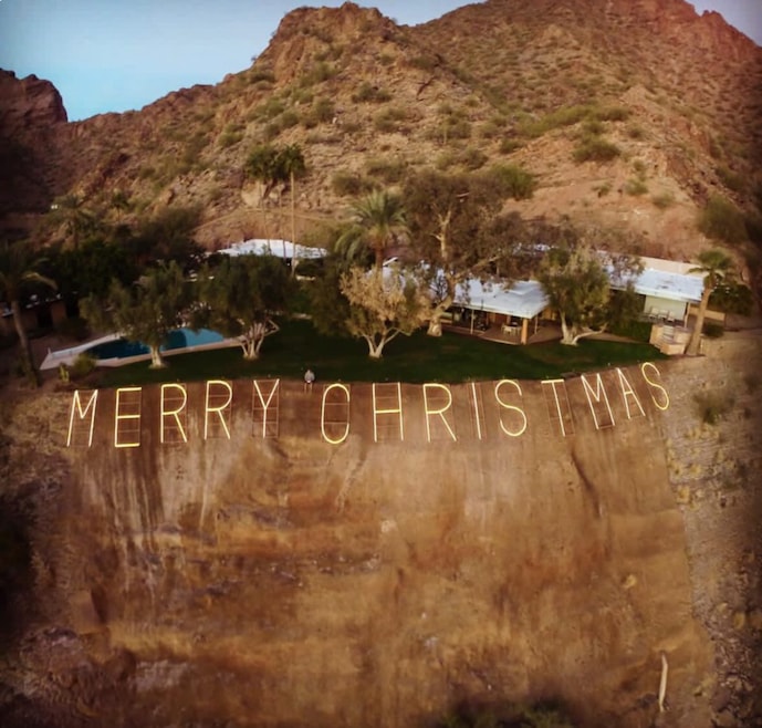 The "Merry Christmas" house in Phoenix is situated atop Camelback Mountain and recently hit the market for $24 million. (RETSY)