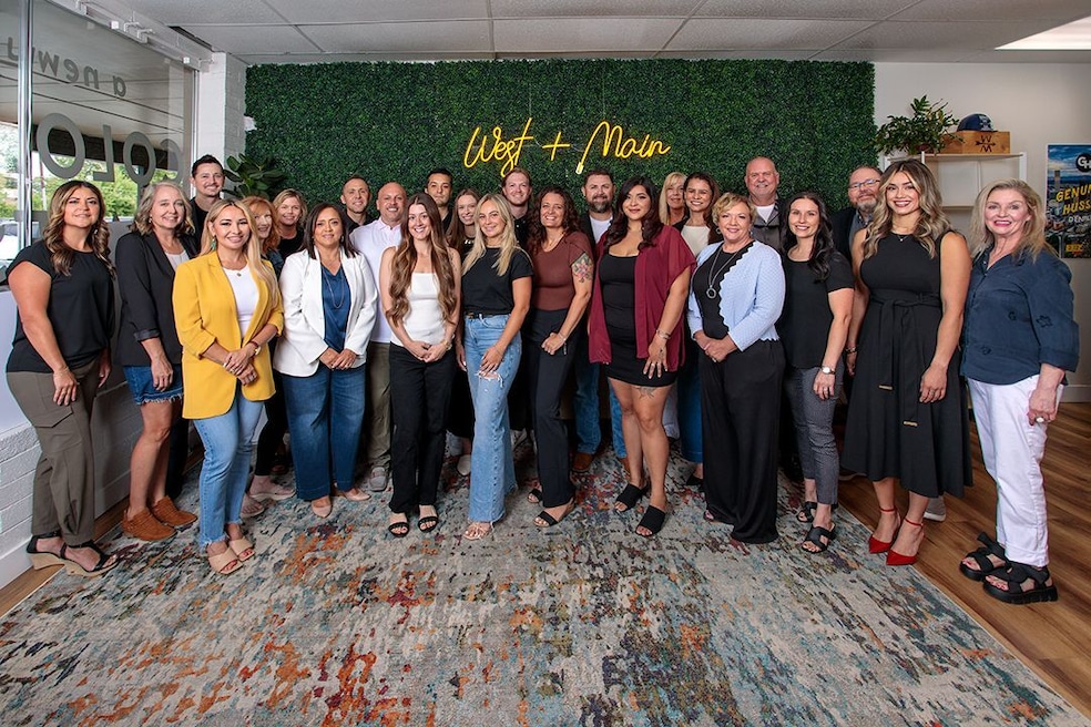 The Front Range Collective team in Colorado poses in one of their new office spaces. (Front Range Collective) 