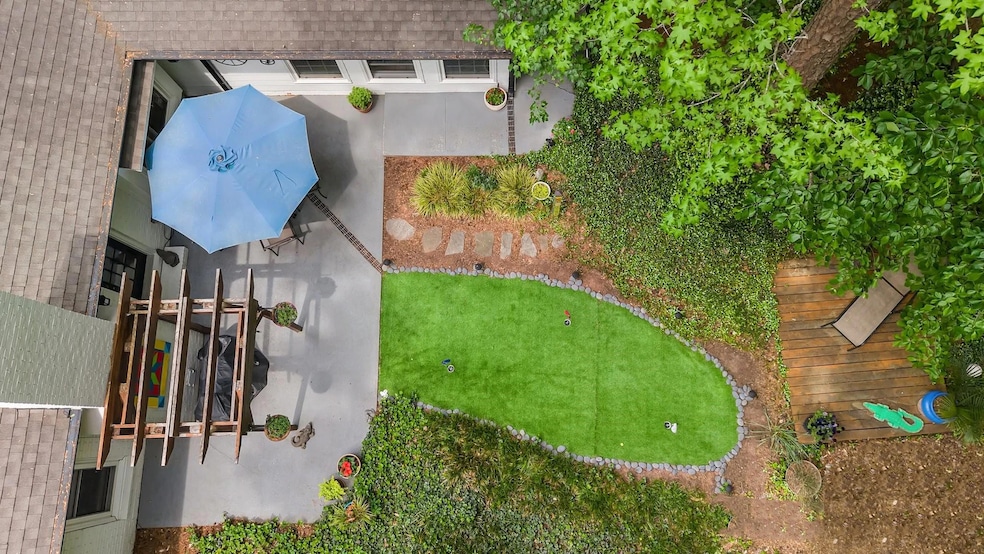 This three-bedroom, two-bath home on the market at 10139 Sardis Oaks Road in Charlotte, North Carolina, has a three-hole putting green with artificial turf. (Sydney Davis/Lighthouse Visuals)