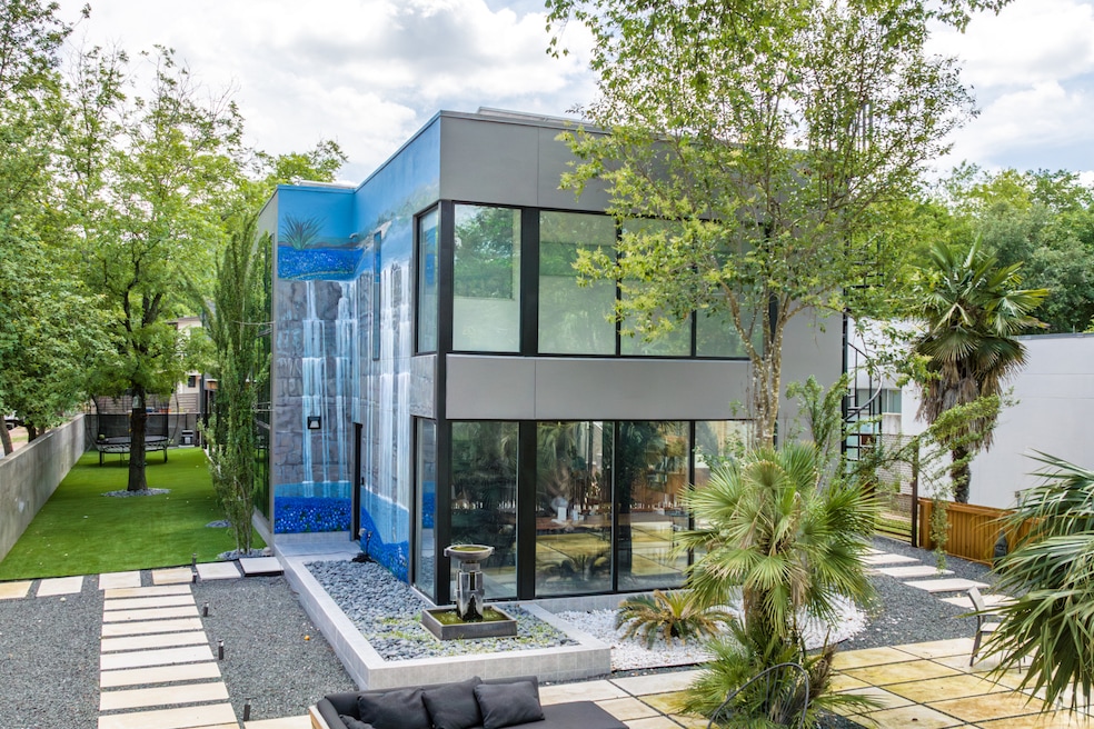 This modern home in Austin’s Bouldin Creek neighborhood got a waterfall mural painted by artist Dan Terry in 2022. (CoStar)