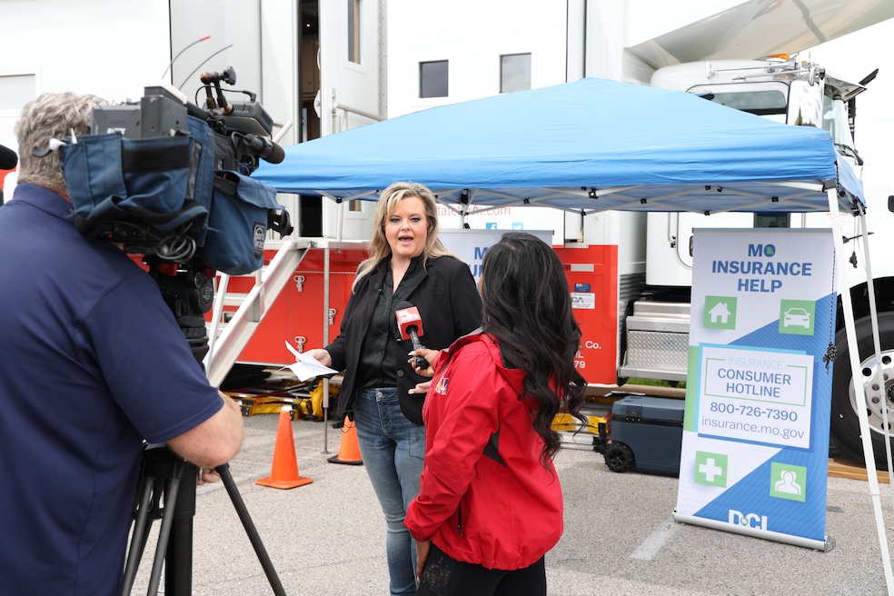 Missouri Department of Commerce and Insurance Director Angela Nelson spoke with a reporter after a tornado destroyed communities in St. Louis, Missouri, earlier this year. (DCI Communications)