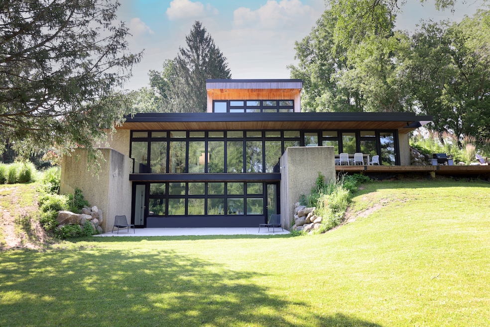 The owners installed all new windows and a top-level suite, seen from the back of the home. (Chris Kayser and Katrina Wittkamp)