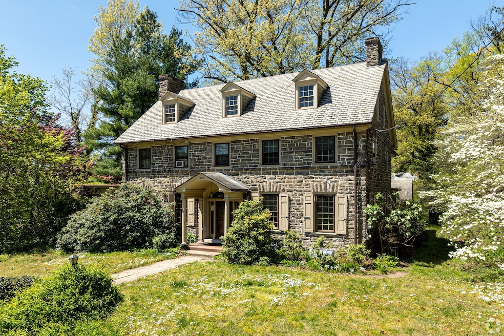 This three-story Georgian home in Philadelphia's East Mount Airy has a slate roof. (Joe Pulcinella/CoStar)