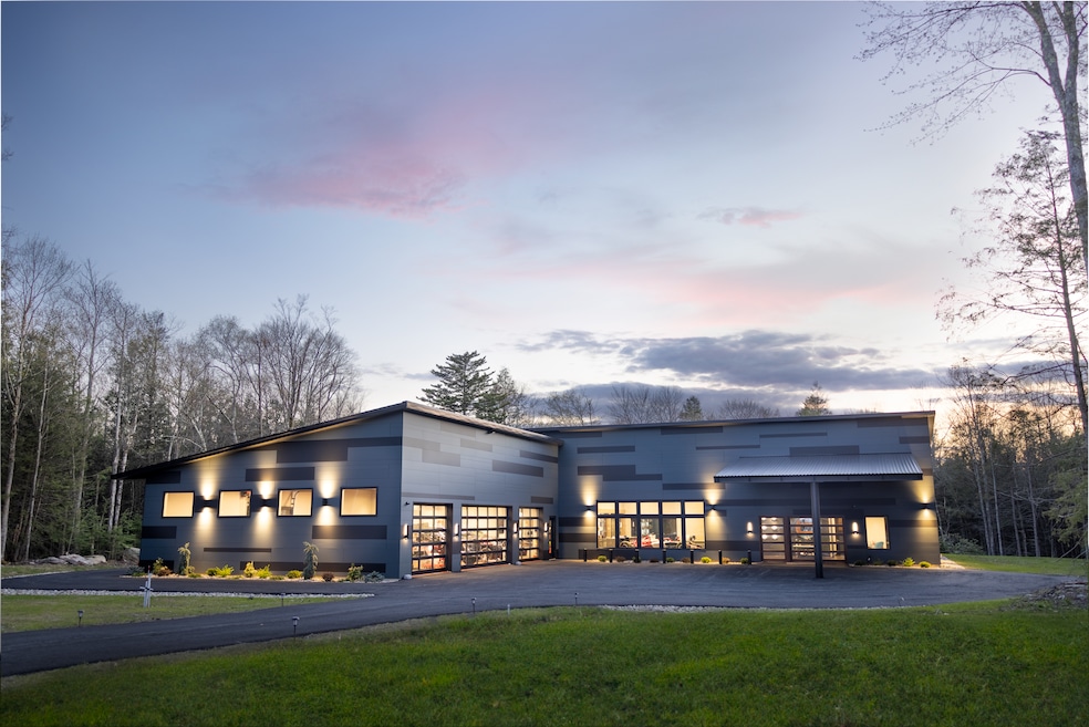 The mansion at 97 Serenity Lane in Monticello, New York, offers a 10-bay auto shop outfitted for repairing and maintaining high-performance race cars. (Mike Bloom)