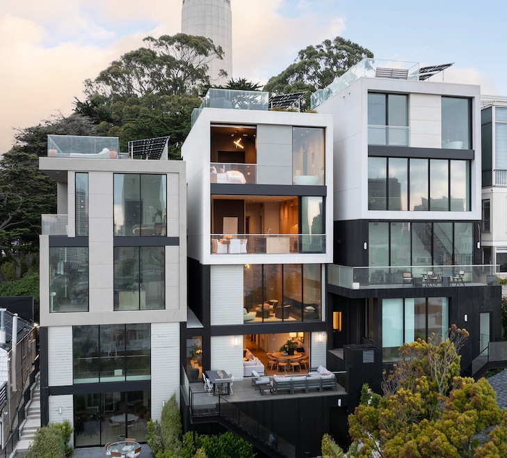 The contemporary home at 117 Telegraph Hill Boulevard is flanked by two similar houses, with Coit Tower looming nearby. (Adam Potts Photography)