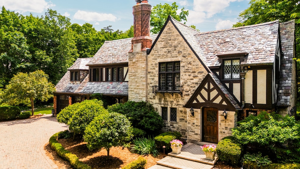 The 1927-built home features a twisted brick chimney, brick facade and multicolored slate roof. (Andrew Haseltine and Jason Lobdell/Knightwing Media)