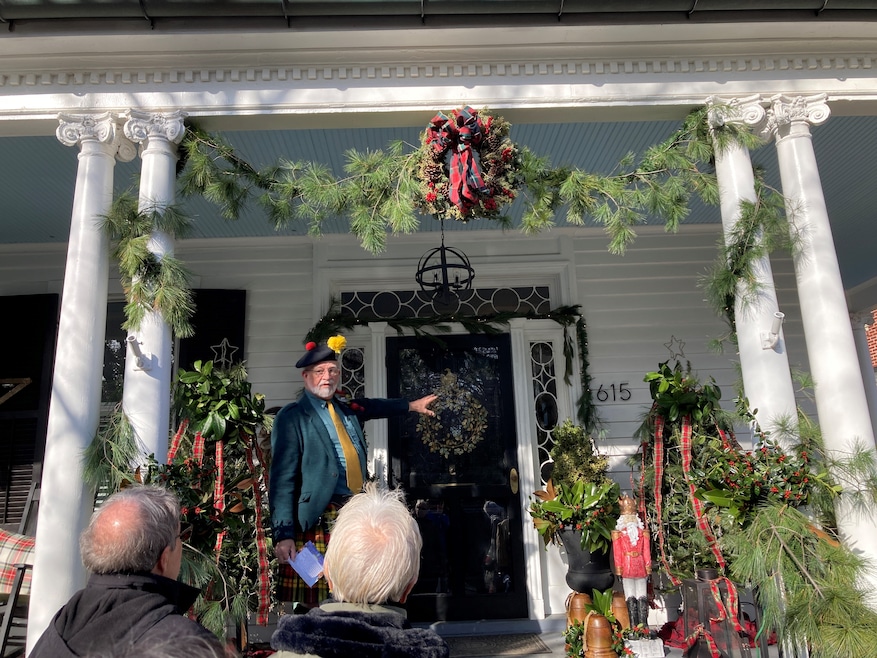 Dressed for the occasion, Dennis Buchanan introduces visitors to a house on Fredericksburg's Candlelight tour. (David Holtzman/CoStar)