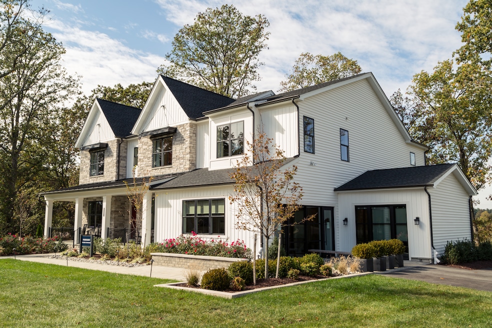 Some versions of the modern farmhouse favor a bright white exterior sharply punctuated by black-framed windows. (Getty Images)