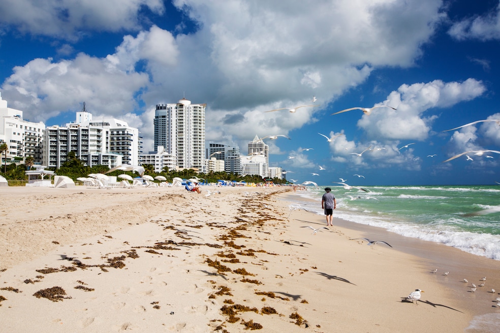 Residential supply continues to grow in Florida, including in Miami. Above: A person strolls along Miami Beach, Florida. (Getty Images)
