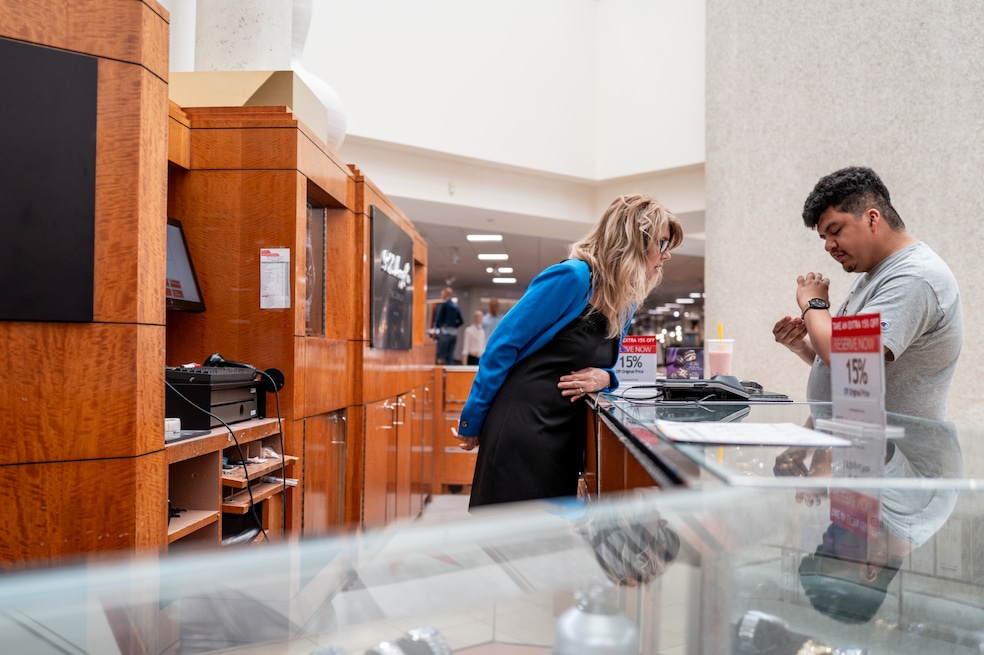 A customer shops for a watch in a Macy's store in Austin, Texas. Consumer confidence is up for the first time in six months, according to the University of Michigan (Brandon Bell/Getty Images) 