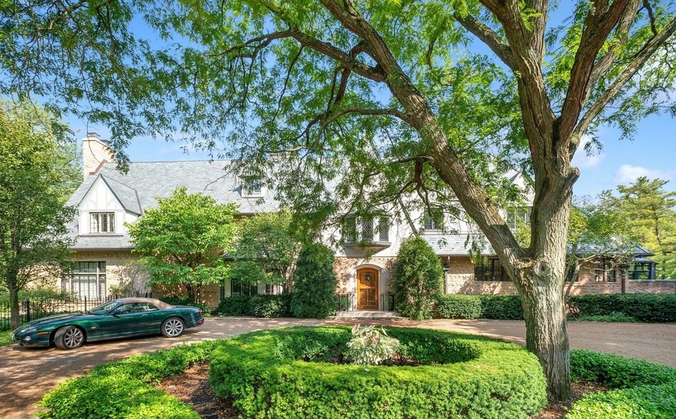This Winnetka, Illinois, home is one of five surrounding a spring-fed pond, most of which were built in the 1920s in an English-manor style. (Sotheby's International Realty)