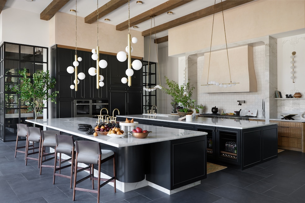 Designer Ginger Curtis, owner of Urbanology Designs, curated a kitchen with two large kitchen islands for a client who enjoyed cooking and hosting. (Urbanology Designs)