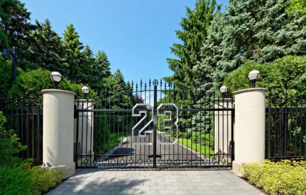The enormous mansion is guarded by gates emblazoned with 23, the former Chicago Bulls player's number. (JS Eckert Photography)