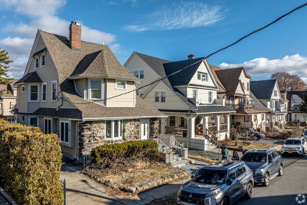 Single-family homes line a residential street in Yonkers, New York. (Pushparaj Aitwal/CoStar)