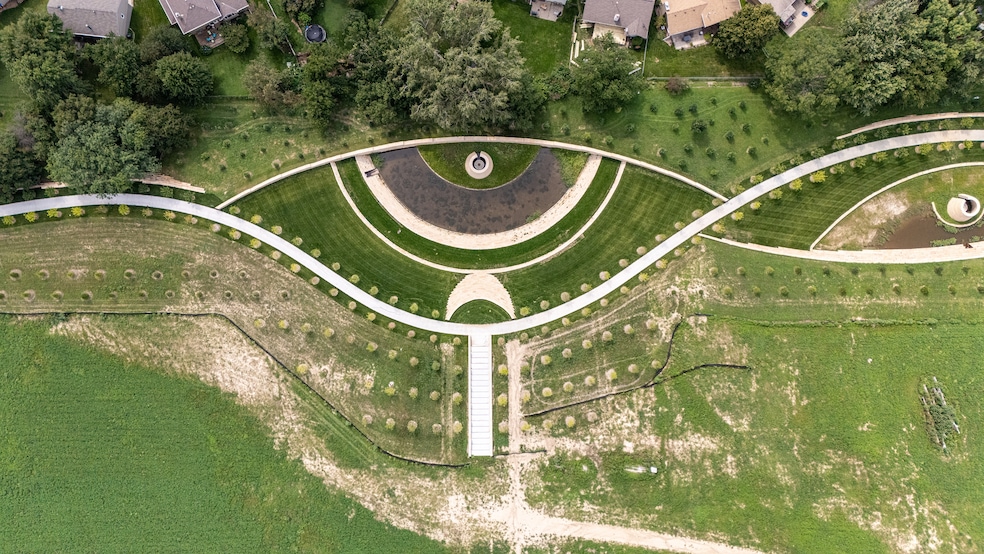 The Heartwood Greenway System in Omaha, Nebraska, contains 14 water detention basins that prevent erosion and recharge aquifers. (DJ Hornacek/Applied Underwriters) 