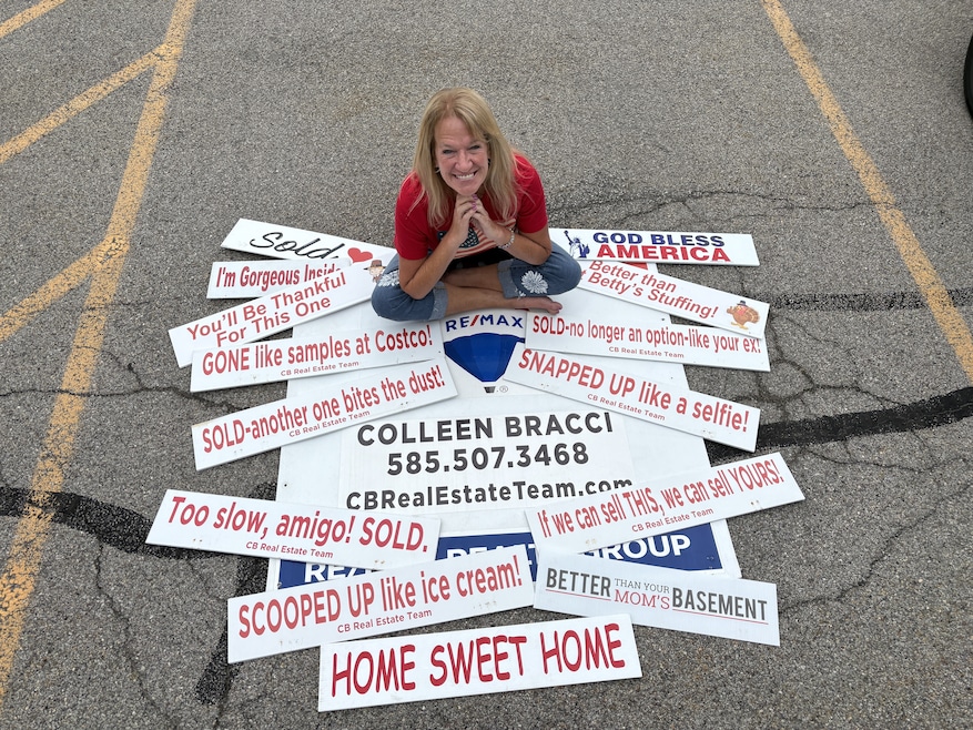 Colleen Bracci is a real estate agent in Rochester, New York, who puts jokes atop her yard signs to advertise her ReMax brokerage. (Erin Scarlata)