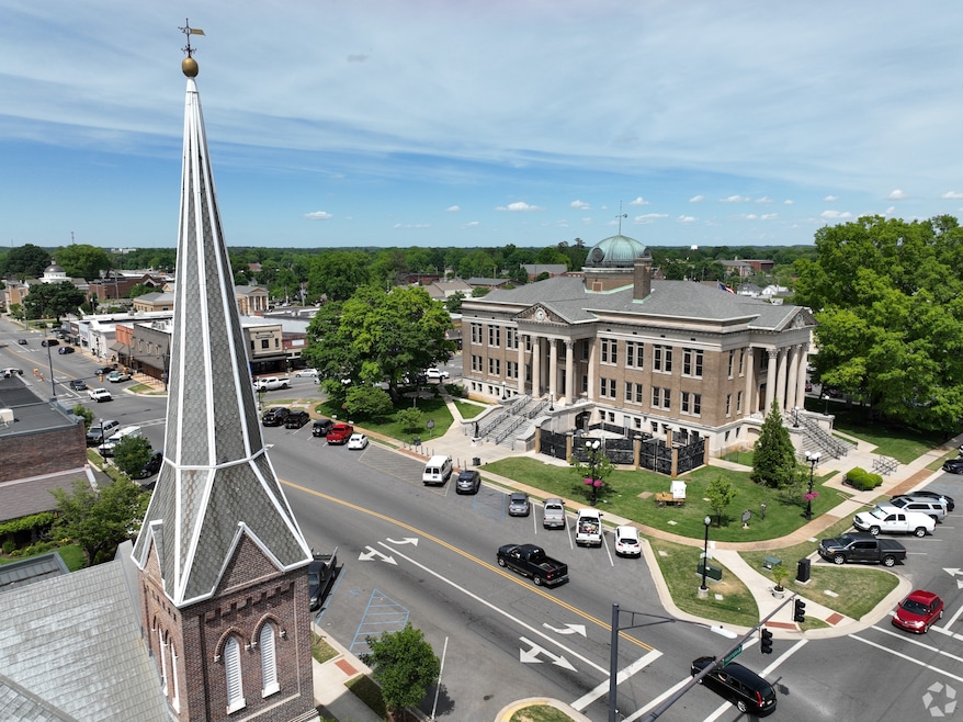 DDB Capital Fund plans to build a community with 255 single-family homes in Athens, Alabama. Its downtown square and courthouse are shown here. (Homes.com)