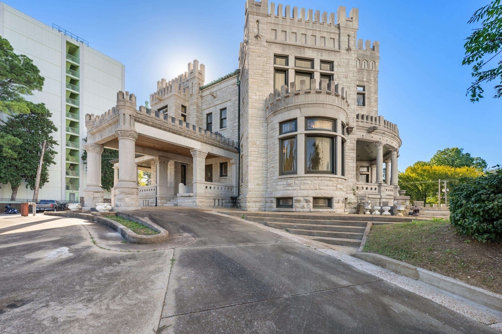 Agent Garth Ward highlights Ashlar Hall's grand entry area as his favorite feature of the house. (Michael Beck)