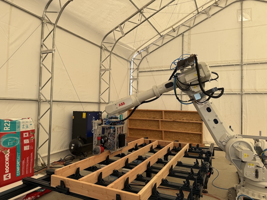 Cosmic Buildings uses a specially programmed robotic arm to build panels used in framing homes. (Moira Ritter/Homes.com)