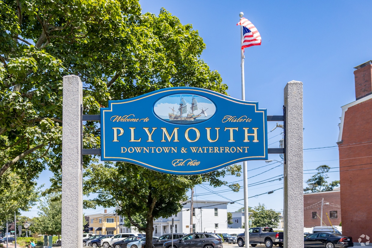This vibrant blue sign welcomes people to downtown Plymouth, where the community's annual Thanksgiving Day parade was held on Nov. 22. (Al Straggas/CoStar)