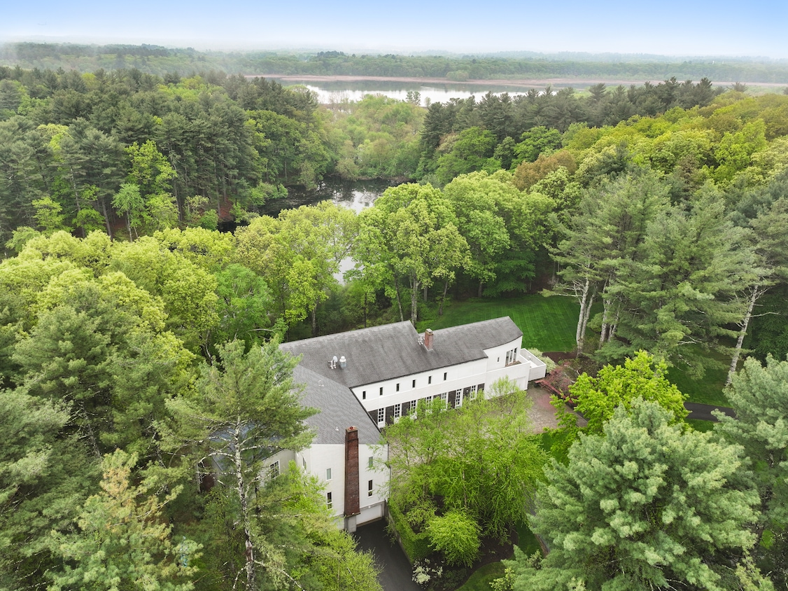 The home's backyard leads to a secluded pond, with the Concord River and a wildlife refuge just beyond. (Jack Vatcher Photography)