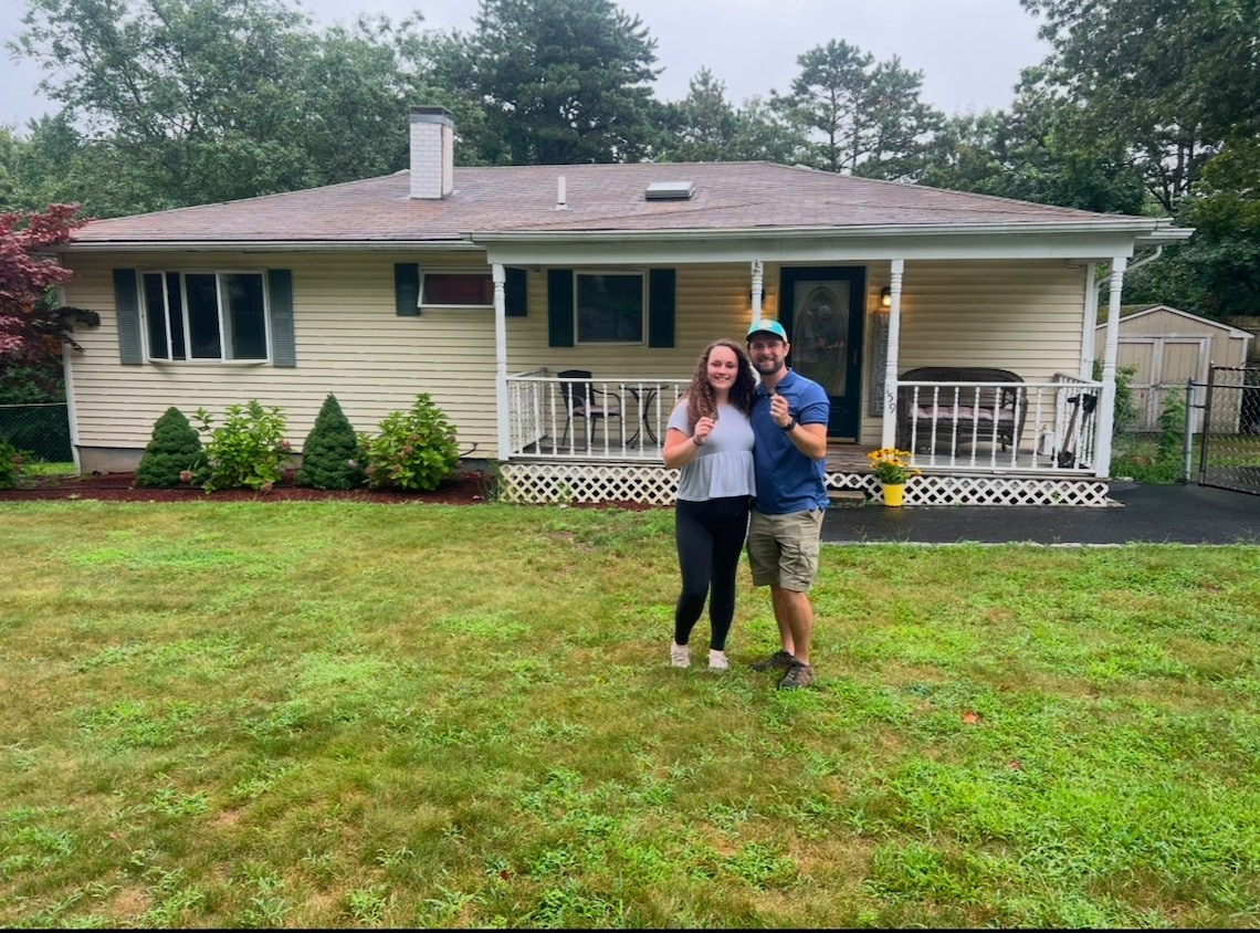 Katelyn Recupero stands in front of the Brookhaven, New York, home she bought last year with her husband, Kevin. (Christopher Recupero)
