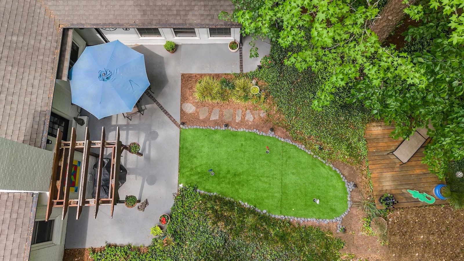This three-bedroom, two-bath home on the market at 10139 Sardis Oaks Road in Charlotte, North Carolina, has a three-hole putting green with artificial turf. (Sydney Davis/Lighthouse Visuals)