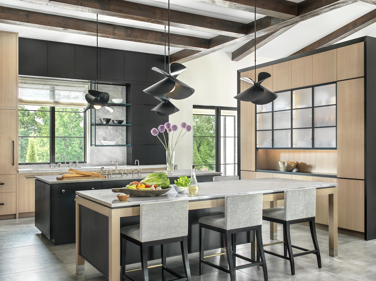 Double kitchen islands offer homeowners two distinct zones for specified functions. Here, in this kitchen by James E. Howard and Kelly Johnson, one acts as a dining table while the other can be used for prepping food. (Alise O’Brien Photography)