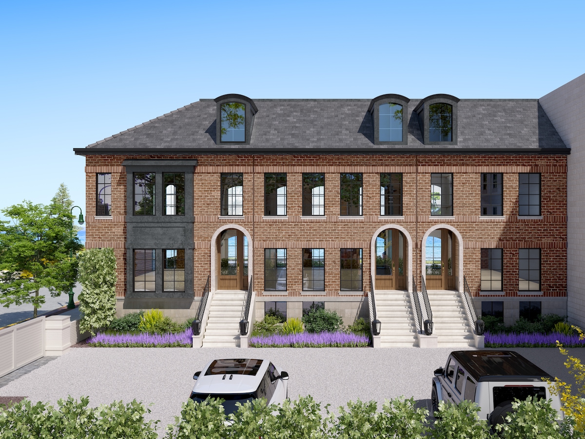 The three under-construction townhouses replaced a former law office through a commercial-to-residential conversion. (Freshwater Development)