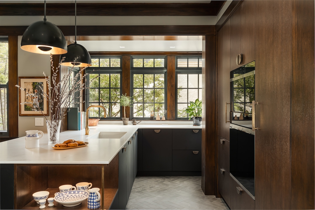 Deep woods add warmth to this kitchen by William Adams. (Tetiana Sokolova)